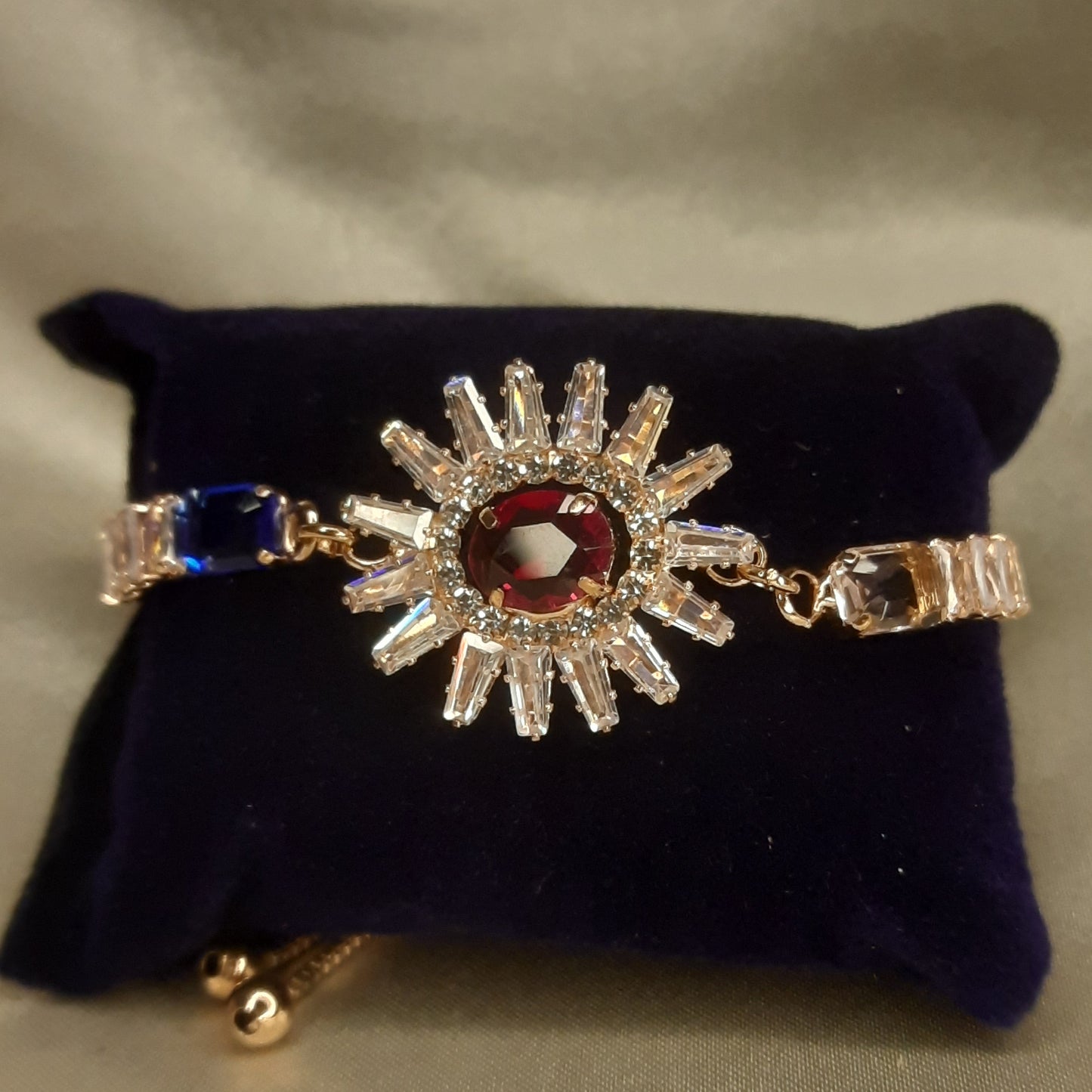 The Helios Ruby Sunburst Bolo Bracelet