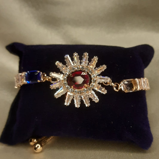 The Helios Ruby Sunburst Bolo Bracelet