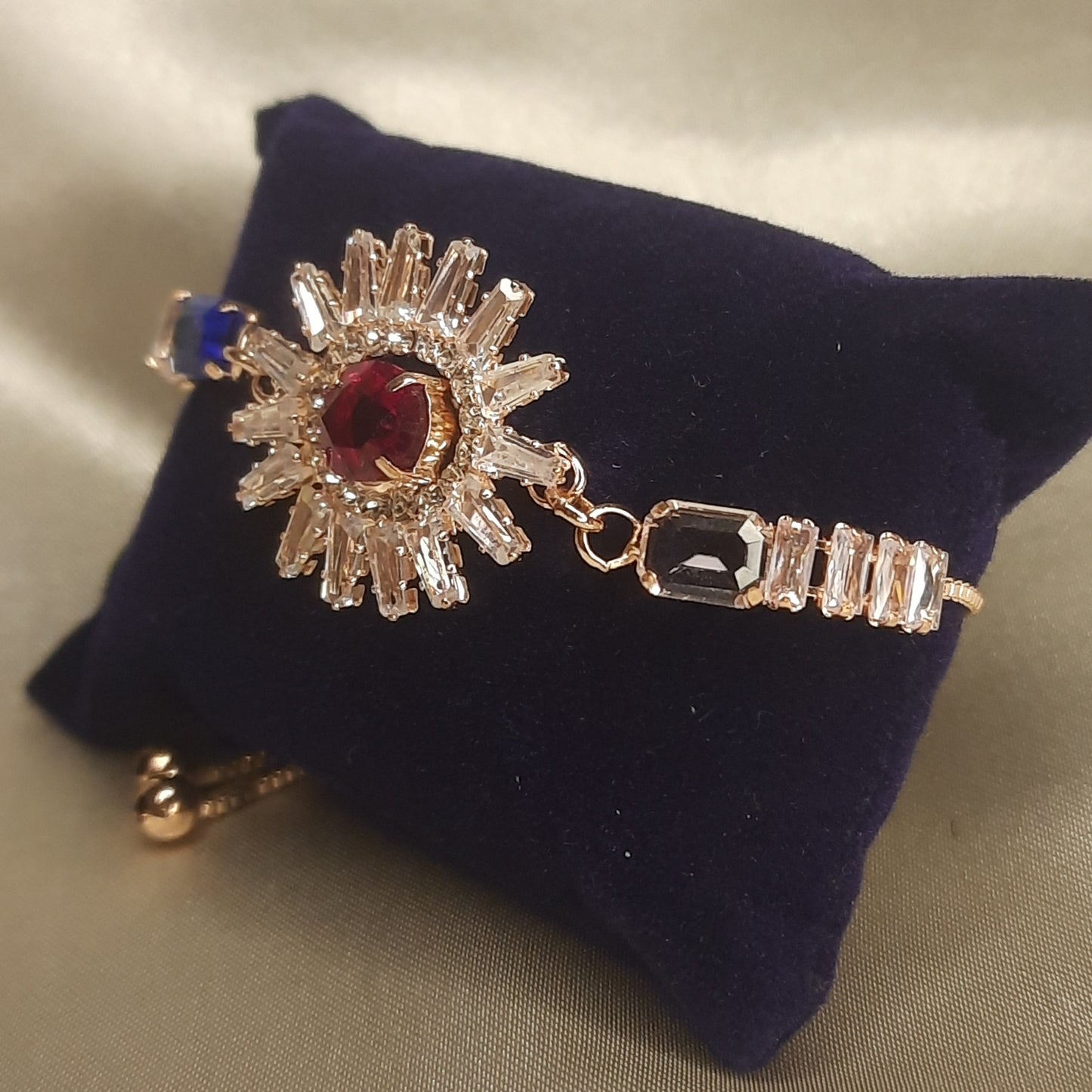 The Helios Ruby Sunburst Bolo Bracelet
