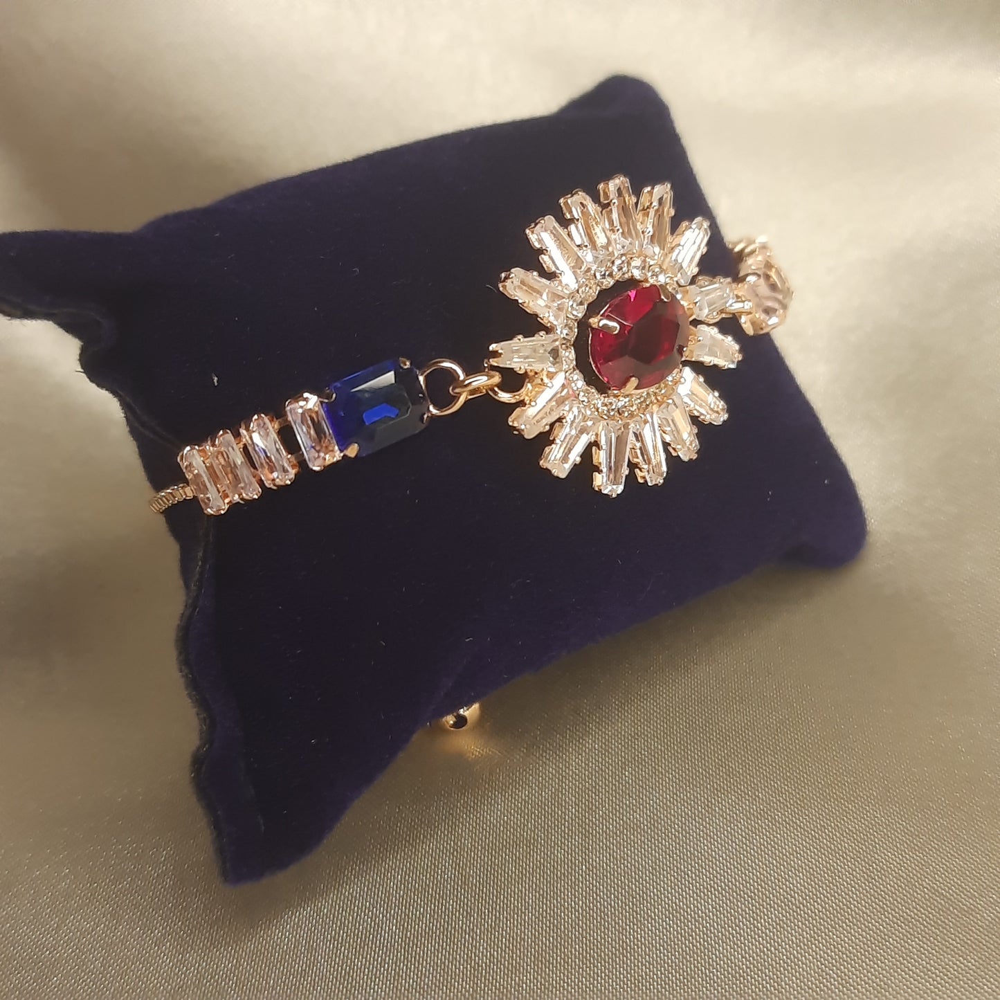 The Helios Ruby Sunburst Bolo Bracelet