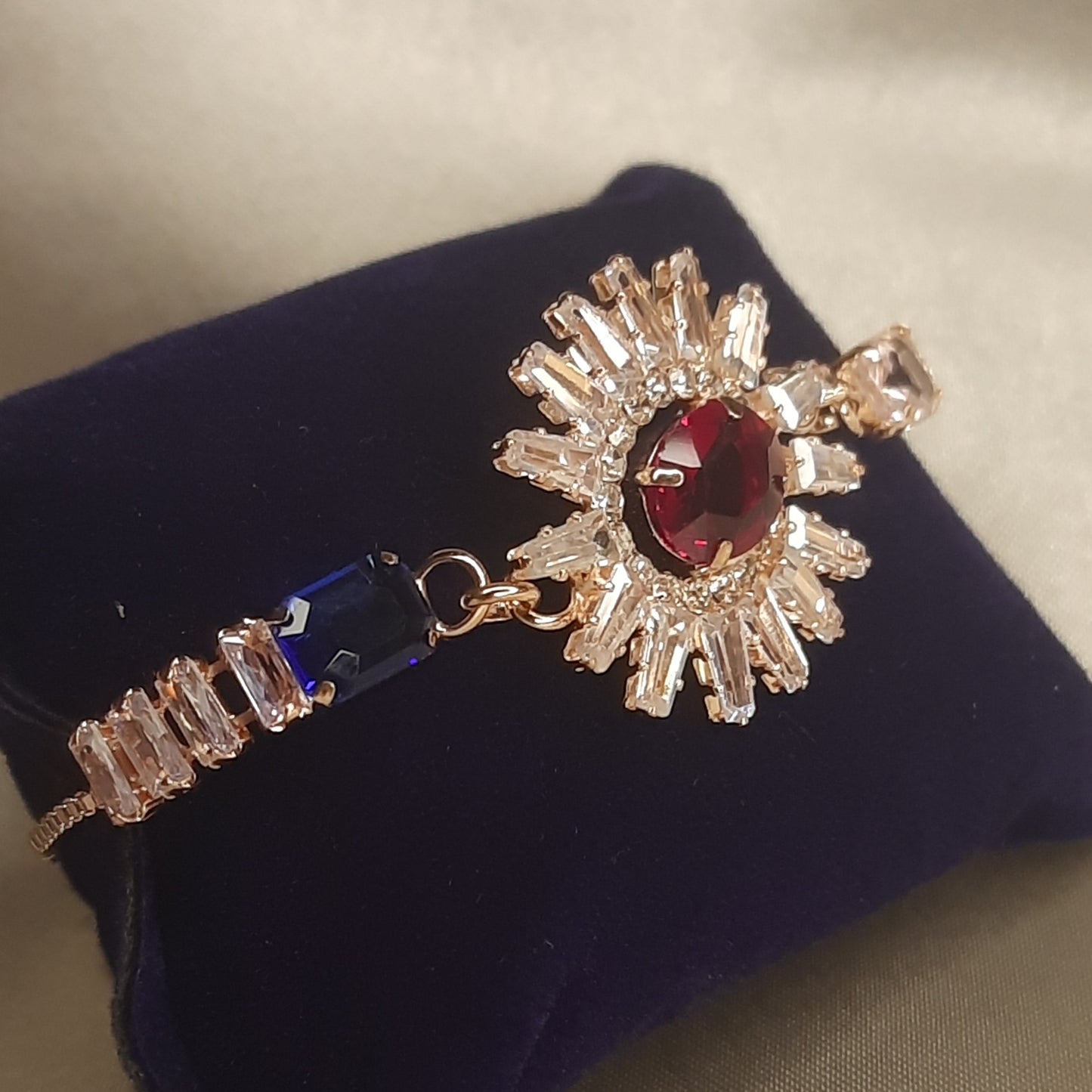 The Helios Ruby Sunburst Bolo Bracelet