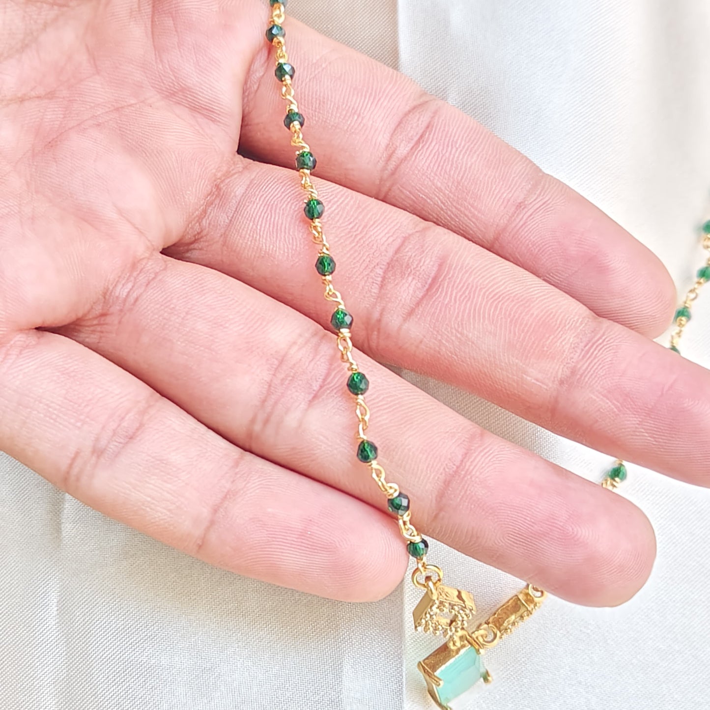 Elegant Gold-Plated Necklace with Green Stone and Crystal Accents