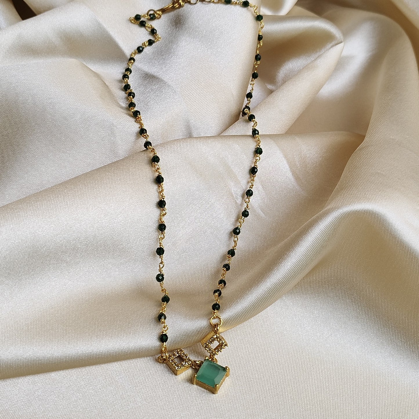 Elegant Gold-Plated Necklace with Green Stone and Crystal Accents