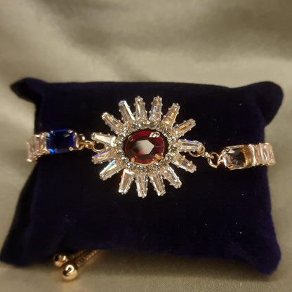 The Helios Ruby Sunburst Bolo Bracelet