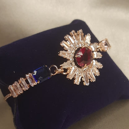 The Helios Ruby Sunburst Bolo Bracelet