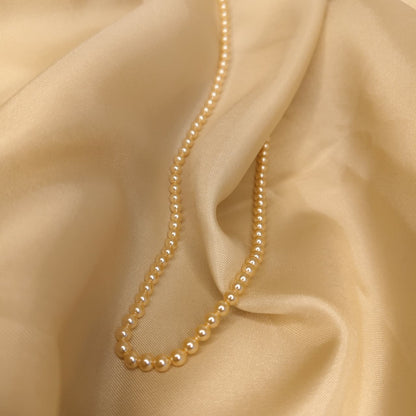 The Light Gold One Strand Swarovski Lumière Pearl Necklace